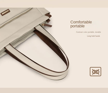 Beige handbag with brown handle on a light beige background
