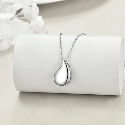 Silver teardrop pendant necklace on a white background