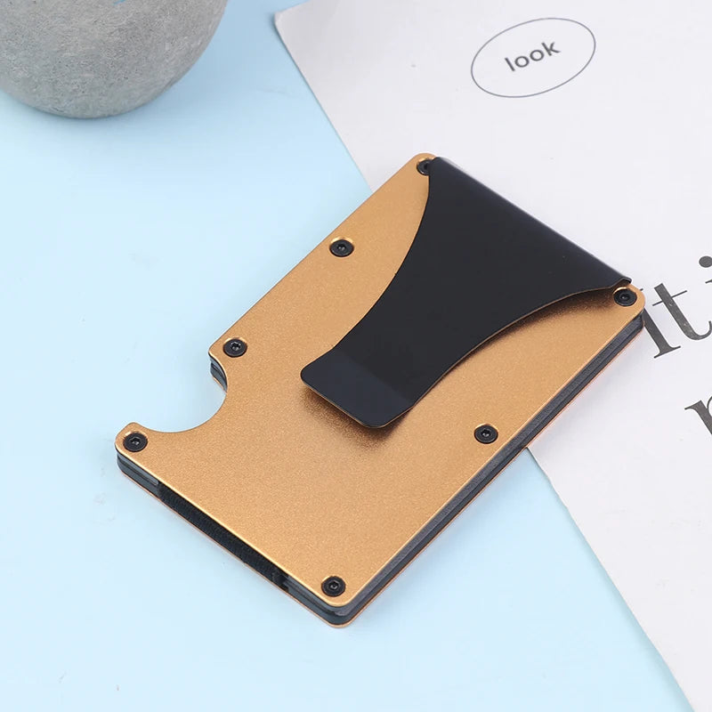 Cardholder with black front and brown back on a light blue surface