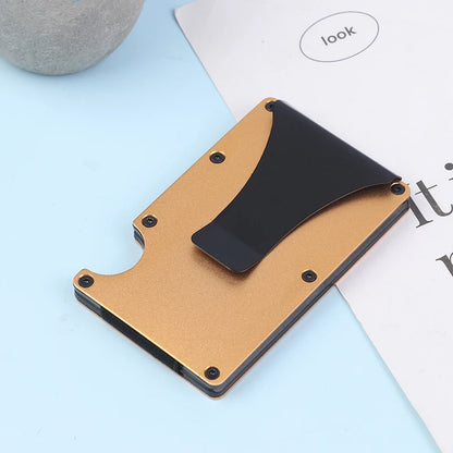 Cardholder with black front and brown back on a light blue surface