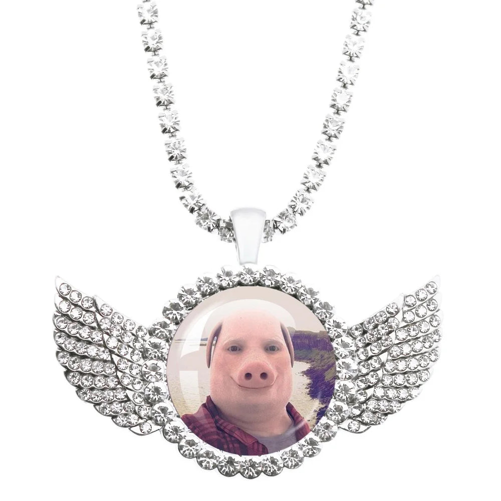 Necklace with a pendant featuring a person's face and wings on a white background