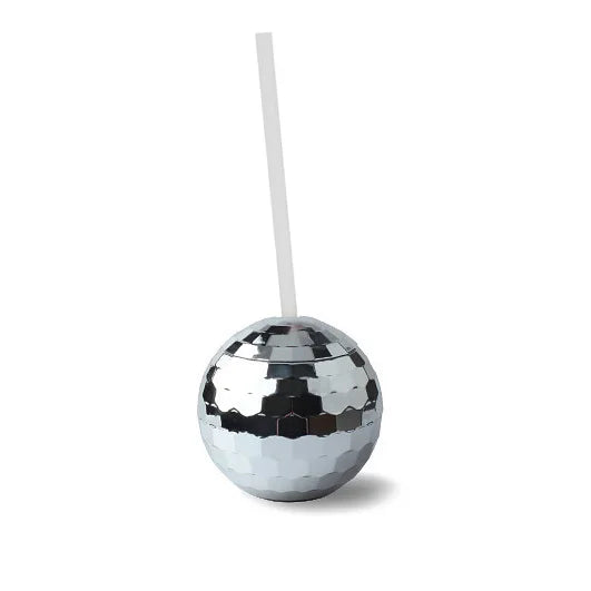 Silver disco ball with a straw on a white background