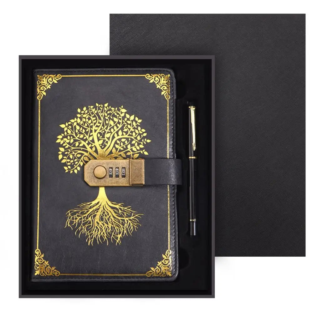 Black notebook with gold tree design and combination lock, accompanied by a pen, in a black box.