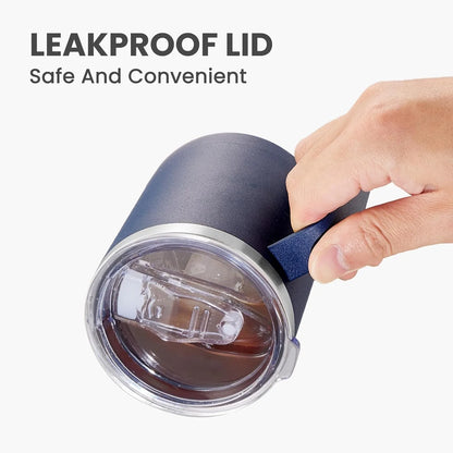 Tumbler with leakproof lid held by a hand on a white background