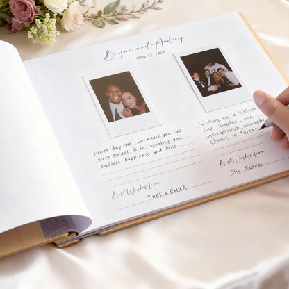 Personalized wedding album with photos and text on a white surface with flowers.