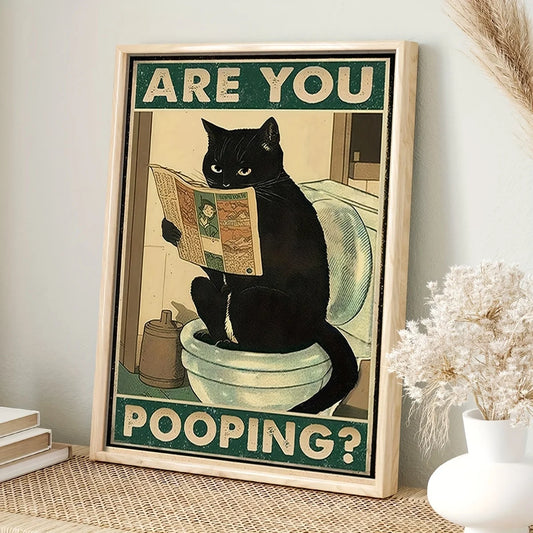Framed poster with a black cat reading a newspaper on a toilet, text 'Are you pooping?' on a light background.