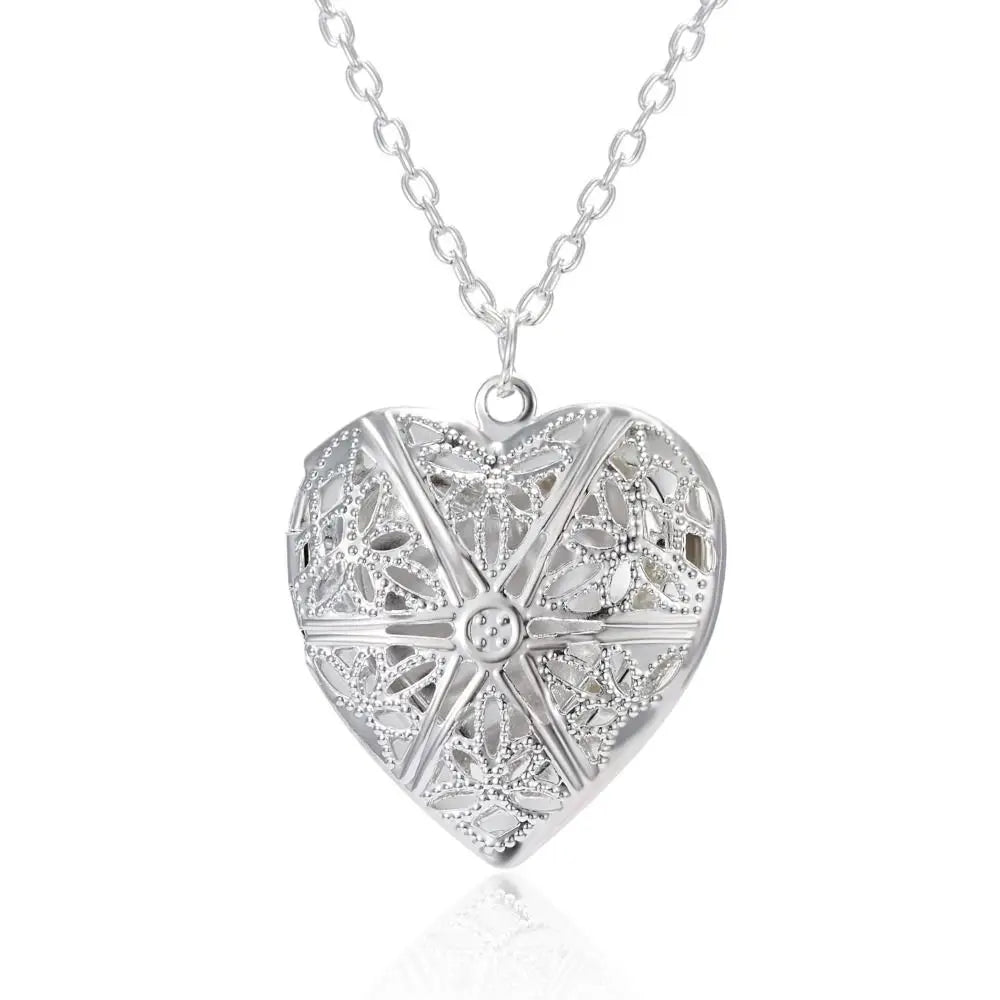 Silver heart-shaped pendant necklace on a white background