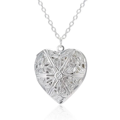 Silver heart-shaped pendant necklace on a white background