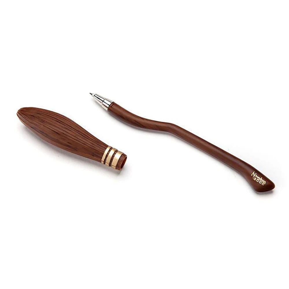 Wooden pen and brush set on a white background