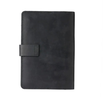 Black leather notebook with a strap on a white background