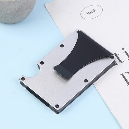 Thin metallic wallet with card holder on a light blue surface