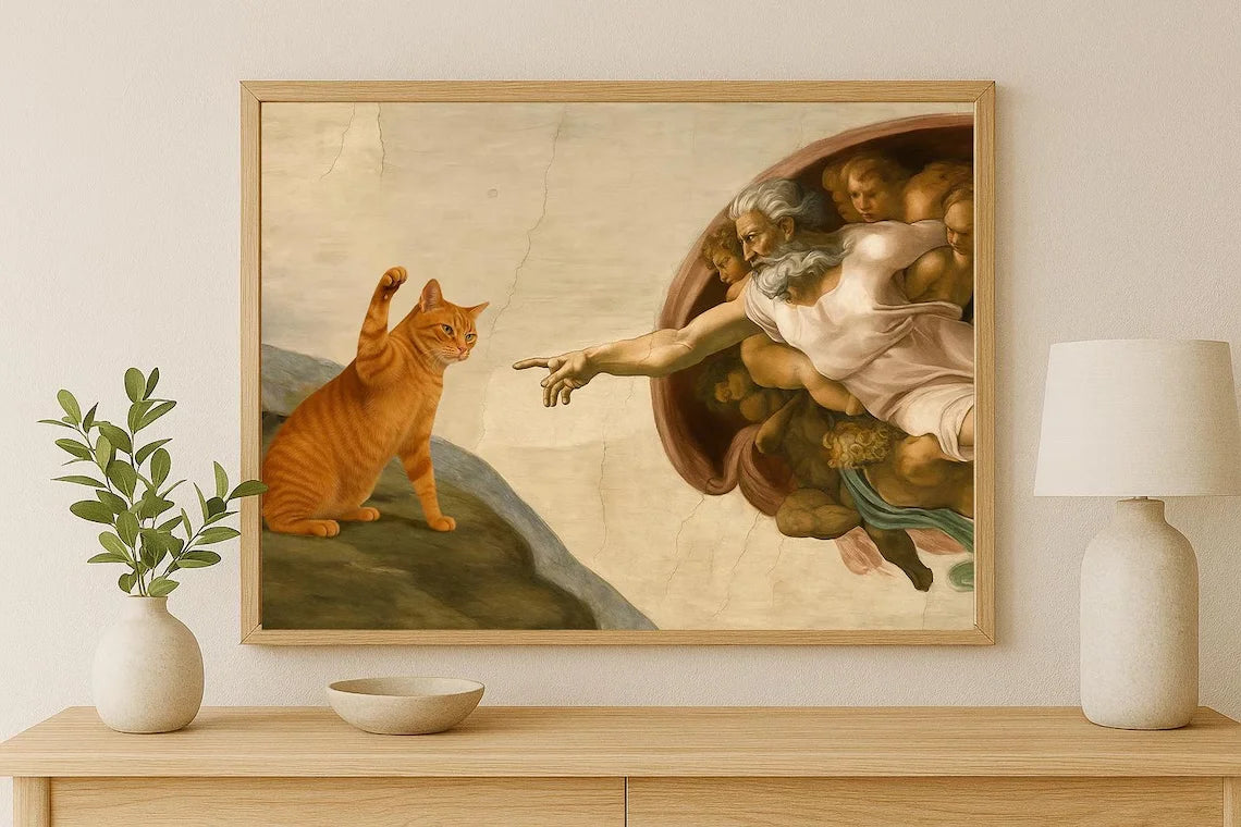 Framed artwork of a cat interacting with classical painting on a wall above a wooden console table.