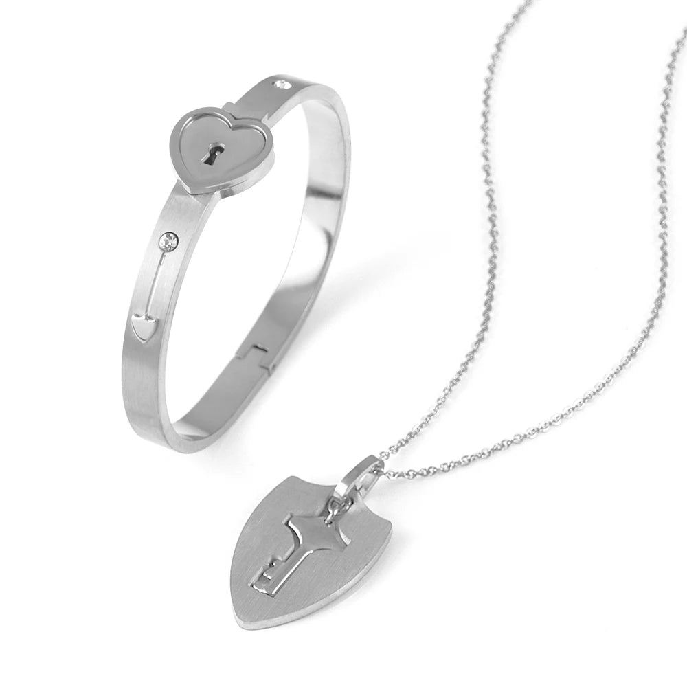 Silver bracelet and necklace set on a white background