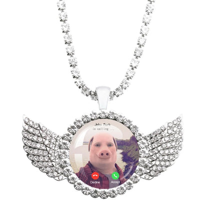 Necklace with angel wing design featuring a photo of a person on a screen