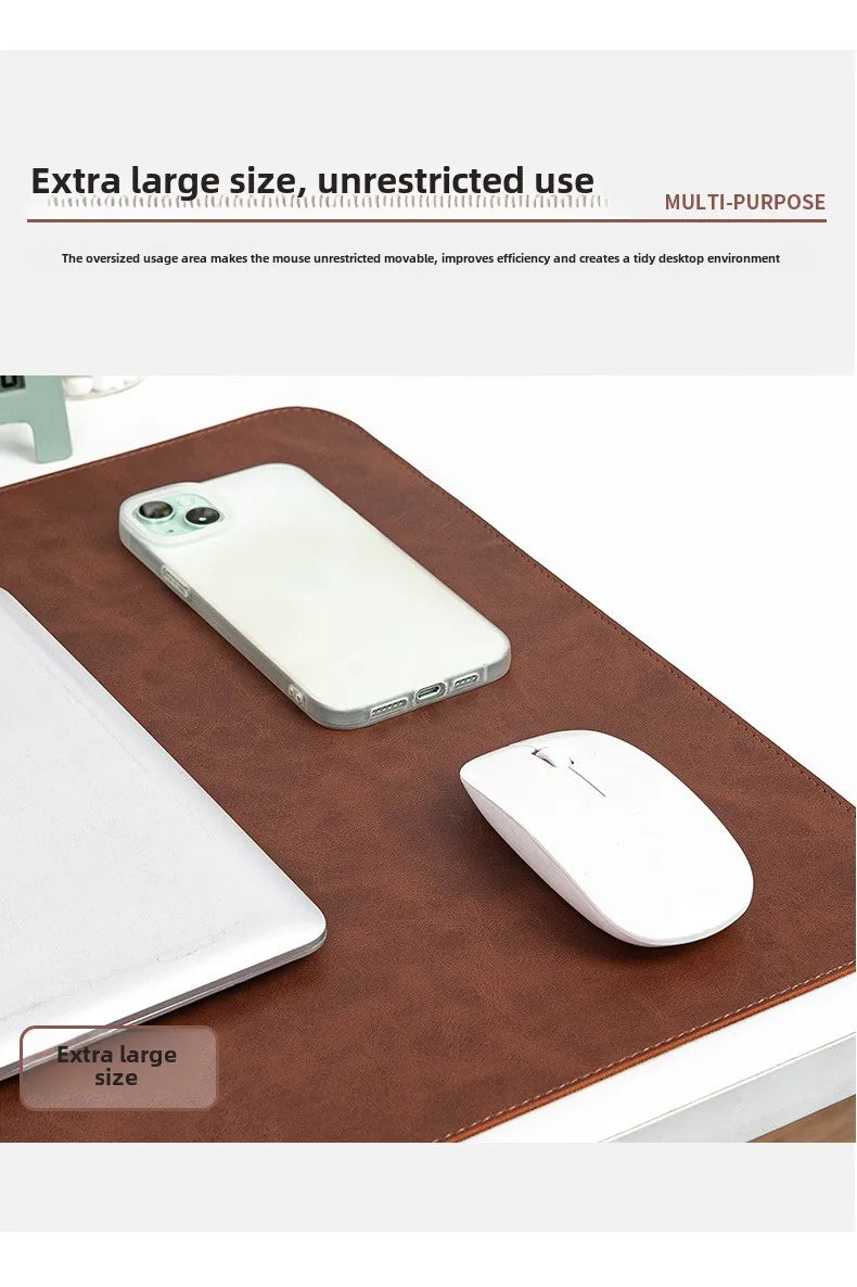 Brown leather desk mat with a phone, laptop, and mouse on a white background