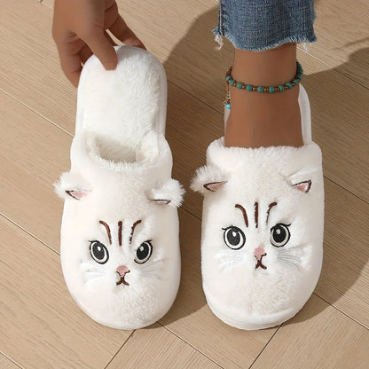 White cat-themed slippers on a wooden floor