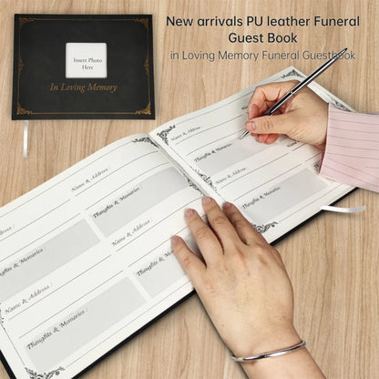 Funeral guest book with hands writing on a wooden surface