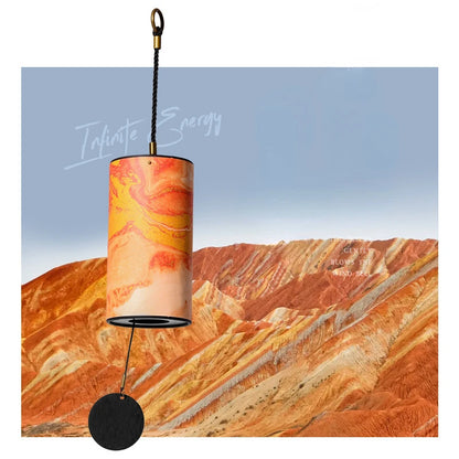 Decorative lamp with marbled design against a desert landscape