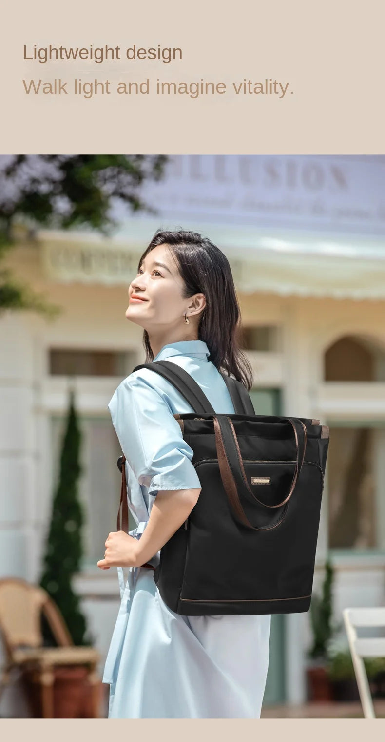 Woman carrying a black handbag with a blurred background