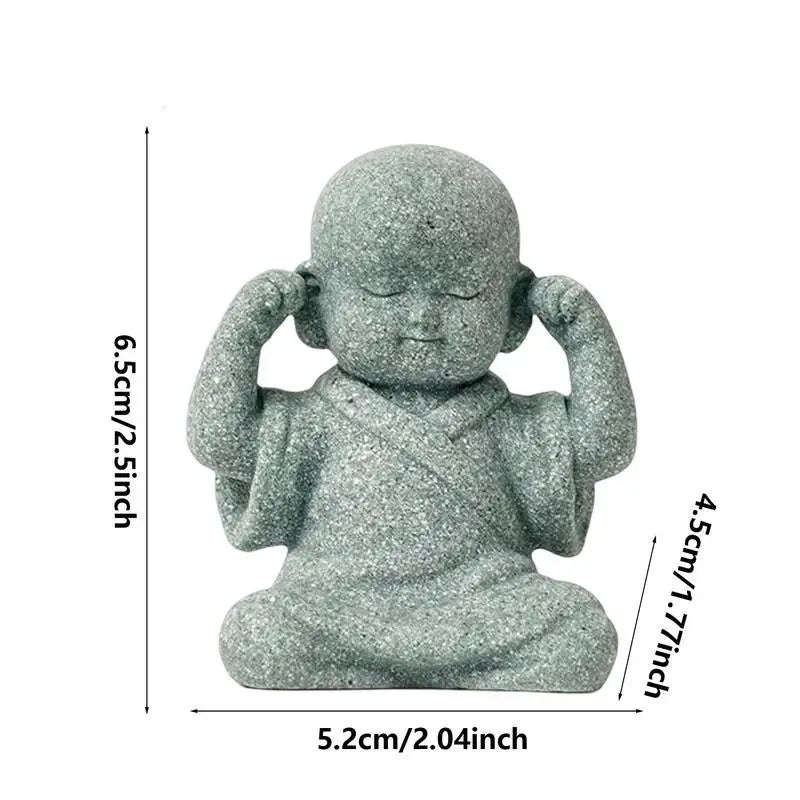Small stone statue of a seated figure with measurements on a white background