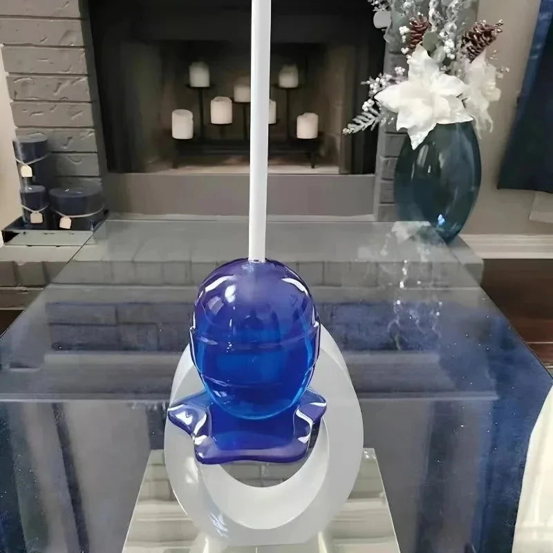 Blue glass object on a white stand in a modern living room setting