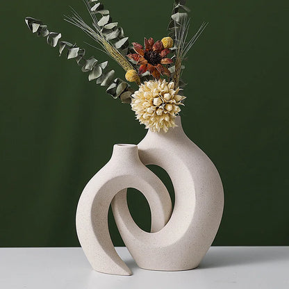Decorative vase with floral arrangement on a dark green background