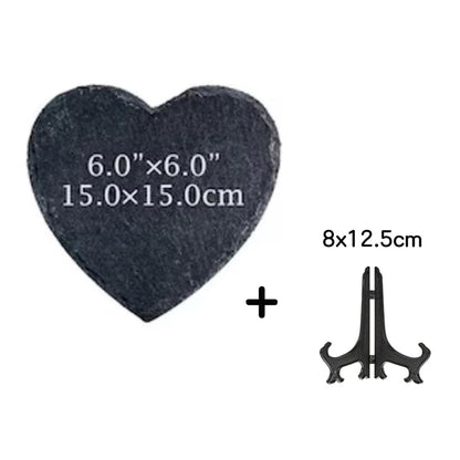 Heart-shaped slate tile and a black metal stand on a white background