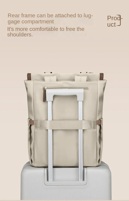 Beige backpack with a luggage compartment attachment on a beige background