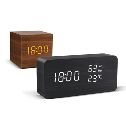 Two digital clocks, one wooden and one black, on a white background.