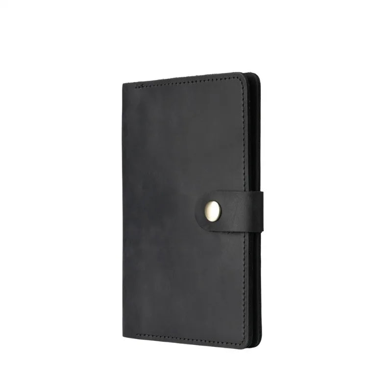 Black leather notebook with a strap on a white background