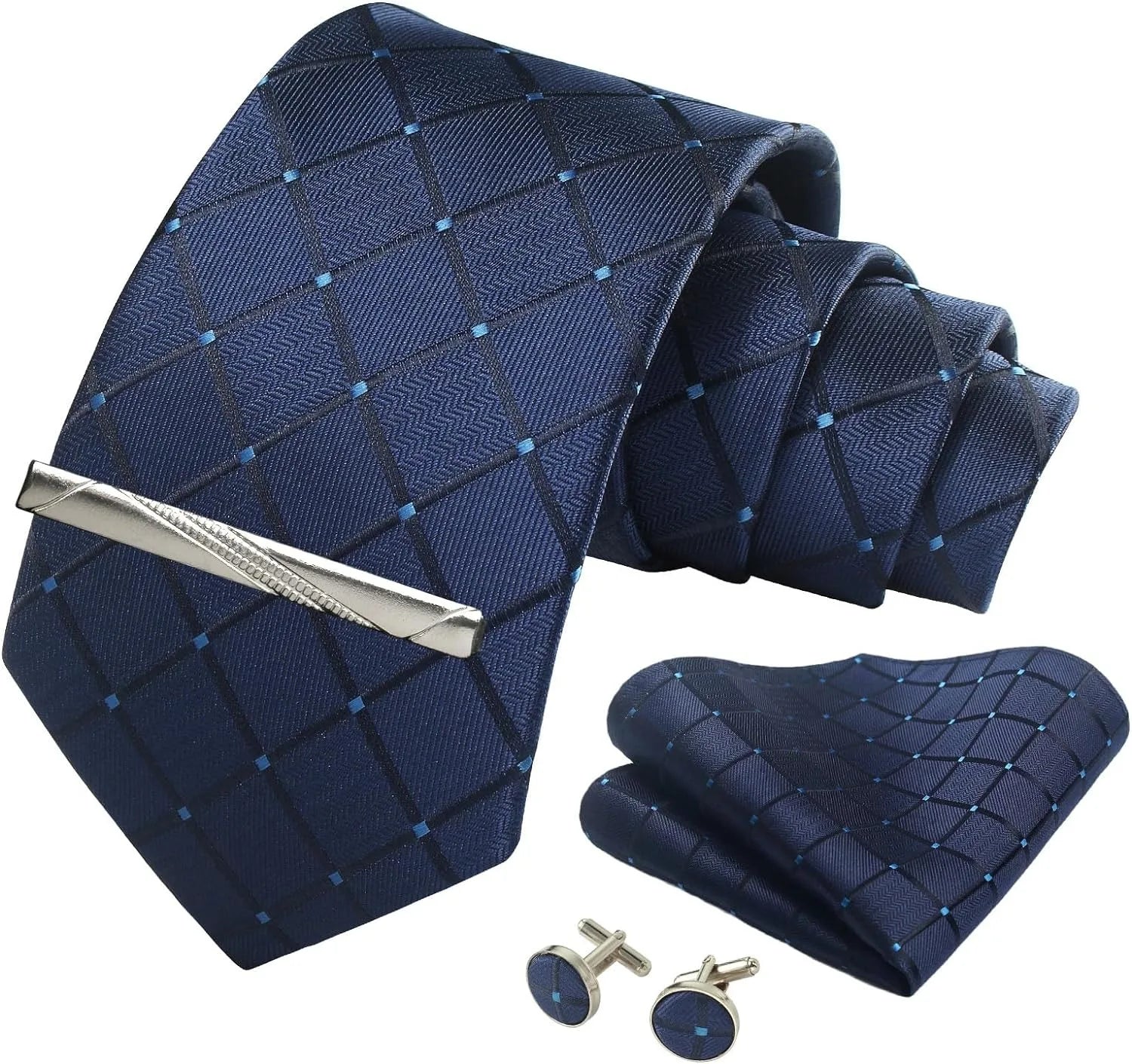 Navy blue patterned tie set with silver tie clip, cufflinks, and pocket square on a white background