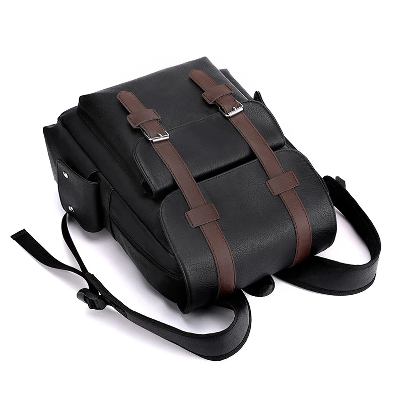 Black backpack with brown straps on a white background