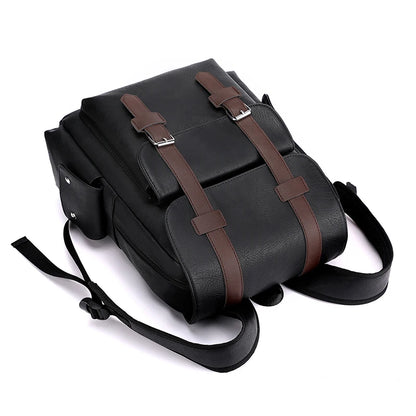 Black backpack with brown straps on a white background