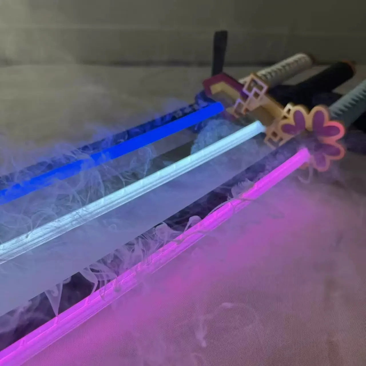 Two glowing swords on a textured surface with a blurred background