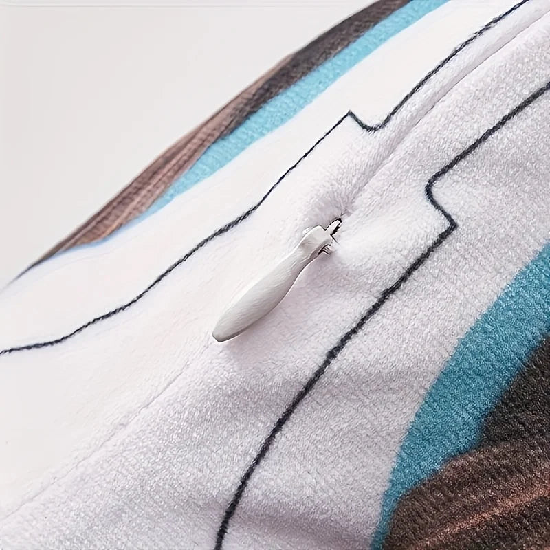 Close-up of a textured fabric with a zipper and button on a light background