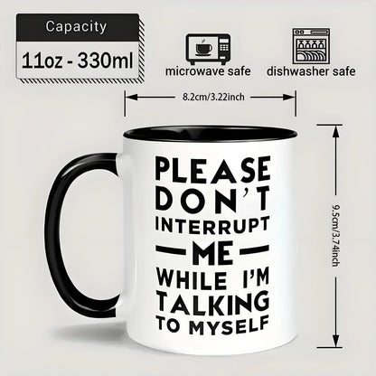 Mug with text 'Please don't interrupt me while I'm talking to myself' and safety features on a light gray background