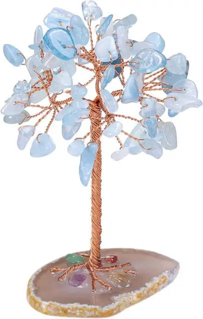 Decorative tree with blue beads on a natural stone base