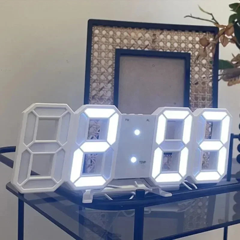 Digital clock on a glass surface with decorative frames in the background