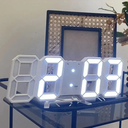 Digital clock on a glass surface with decorative frames in the background