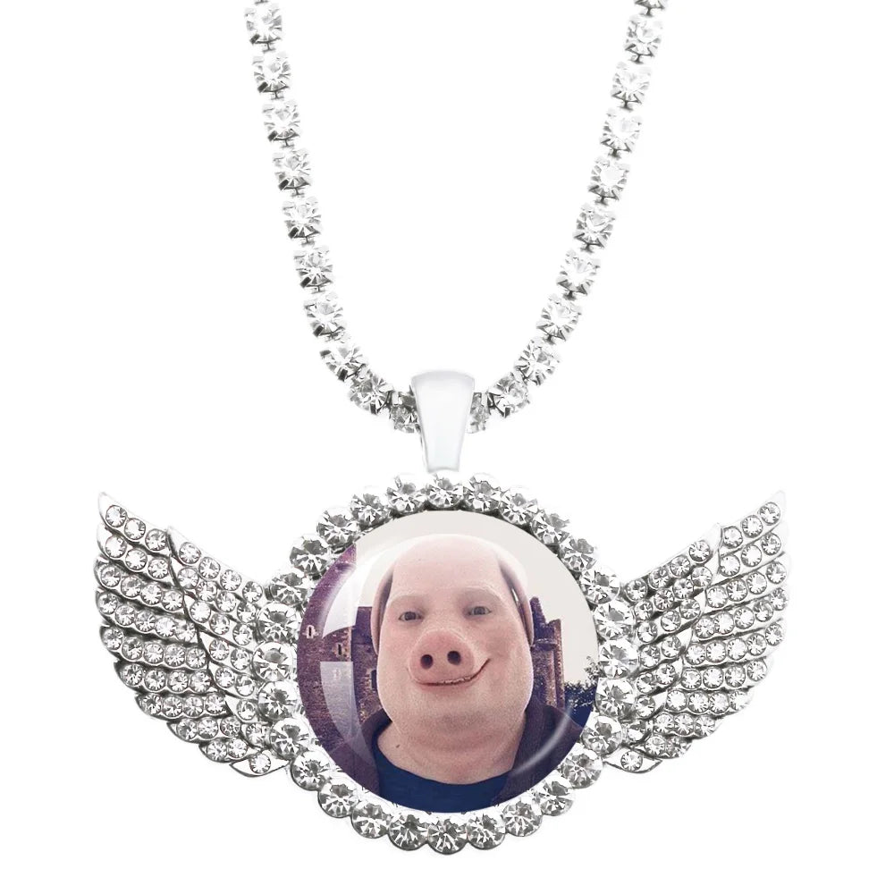 Necklace with a pendant featuring a pig's face and wings on a white background