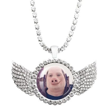 Necklace with a pendant featuring a pig's face and wings on a white background