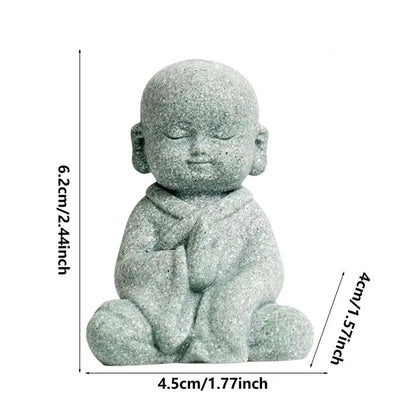 Small stone statue of a seated figure with dimensions indicated on a white background