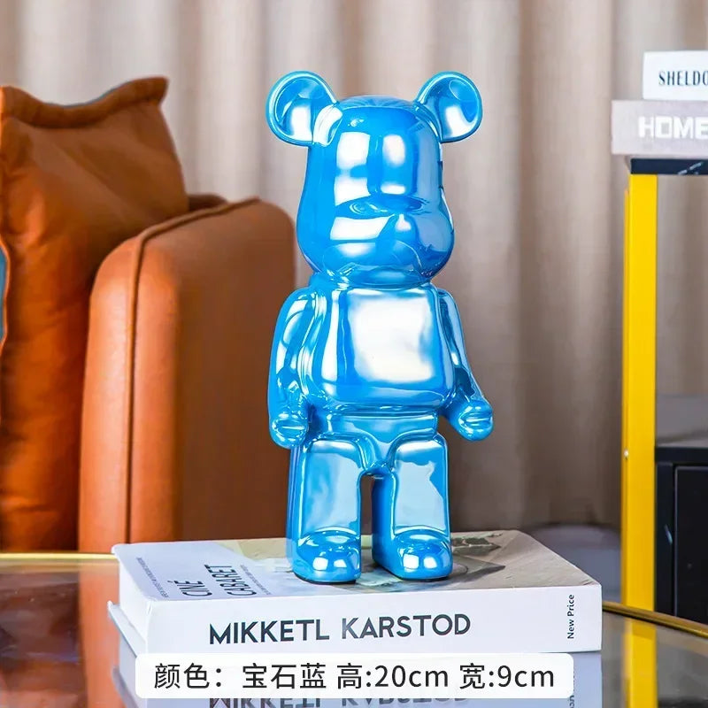 Blue bear-shaped object on books with a blurred background