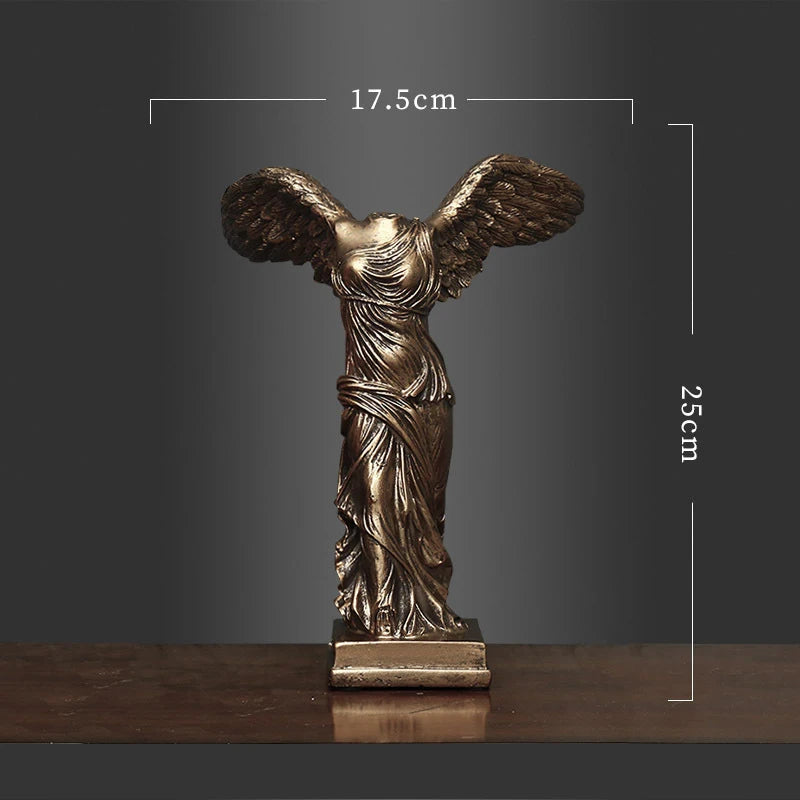 Bronze statue of a winged figure with dimensions on a dark background
