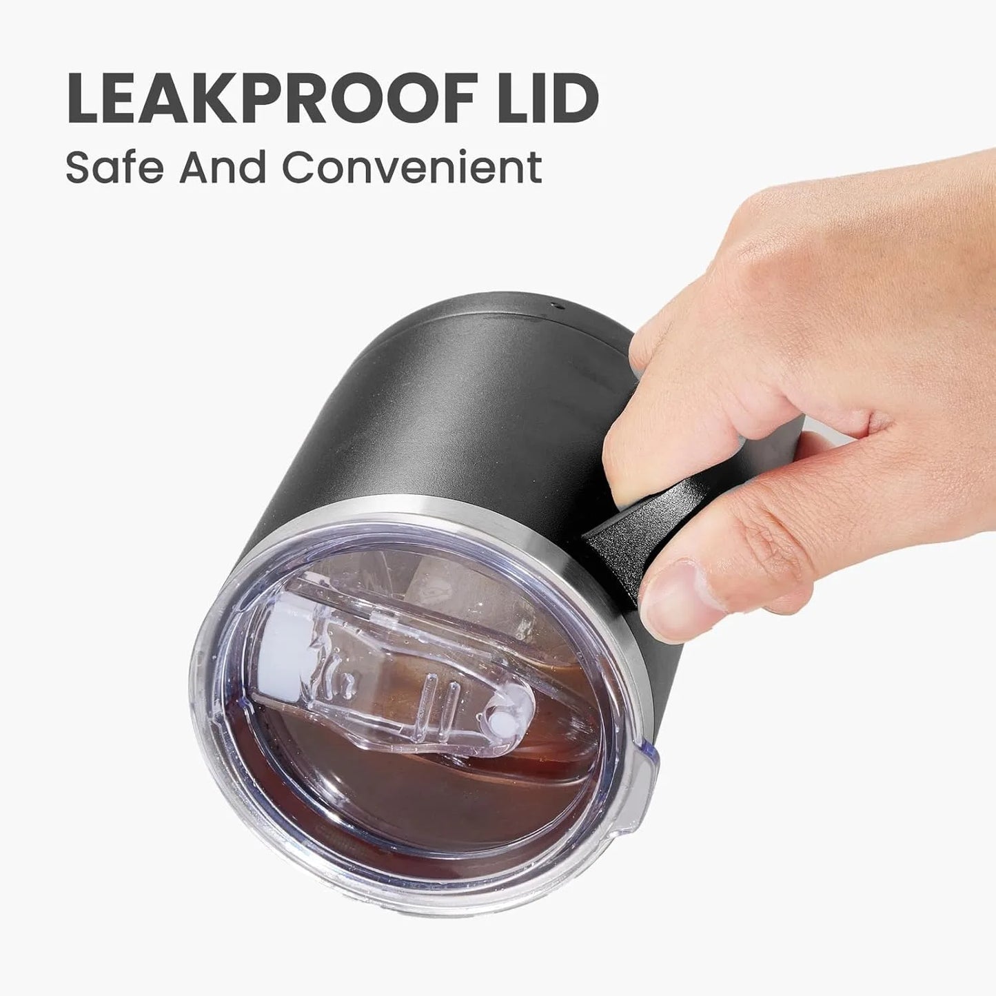 Black tumbler with a leakproof lid held by a hand, on a white background.