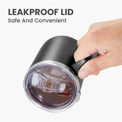 Black tumbler with a leakproof lid held by a hand, on a white background.