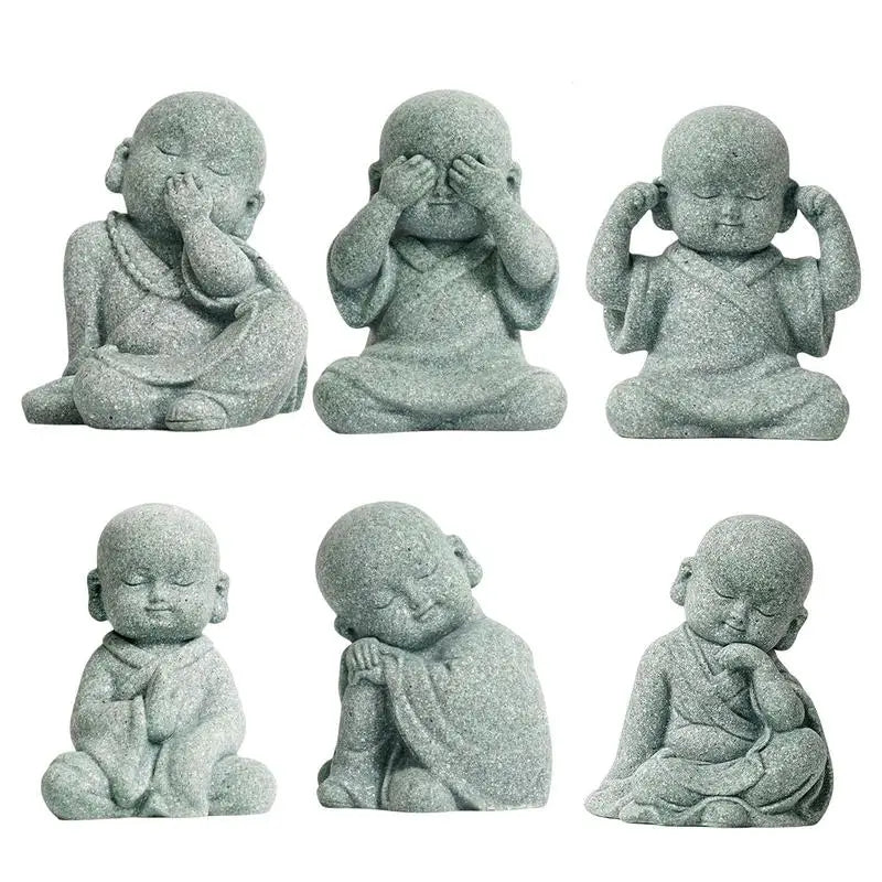 Set of six stone statues of a meditating monk with different poses on a white background