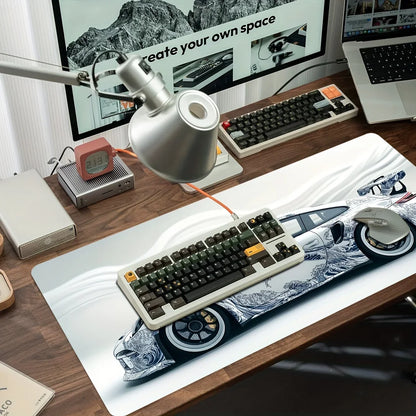 Computer setup with keyboard, mouse, and monitor on a desk.