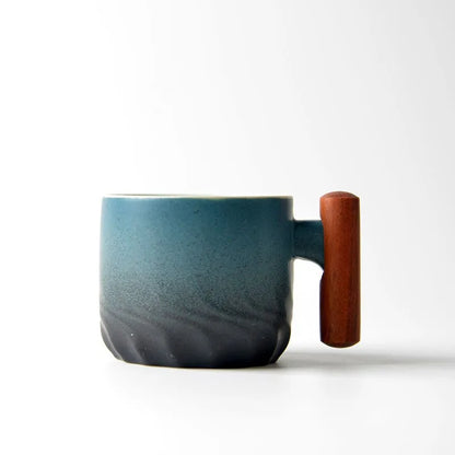 Blue mug with a wooden handle on a white background