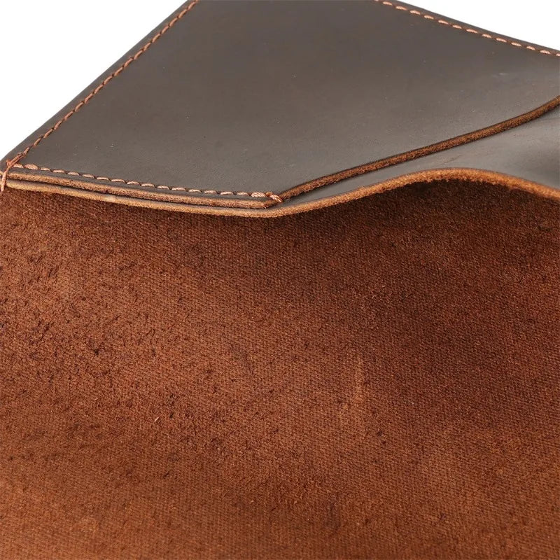 Close-up of a brown leather product with visible stitching